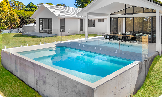 Modern backyard pool with a sleek design and clear blue water.
