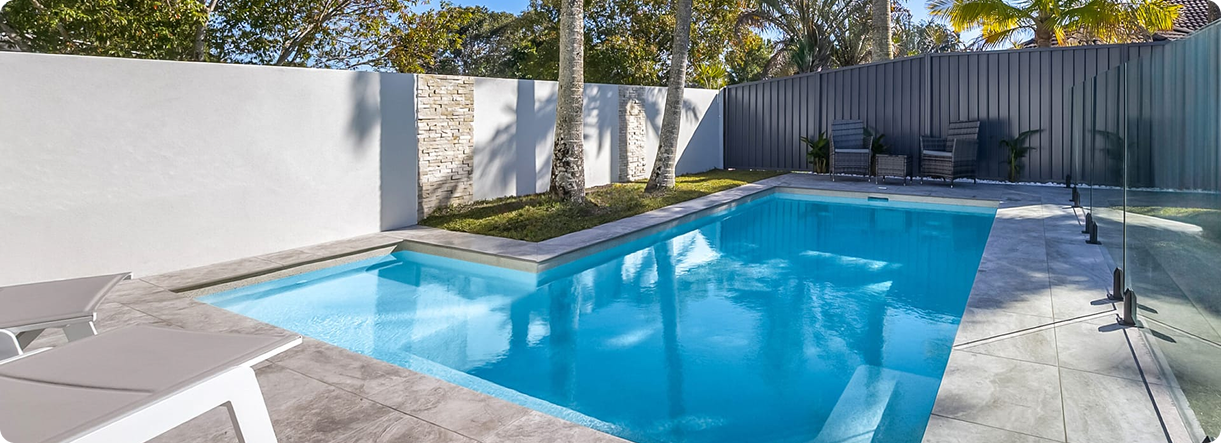 Modern concrete plunge pool with clean design and surrounding outdoor area.