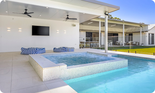 Modern backyard with concrete plunge pool and outdoor living area.